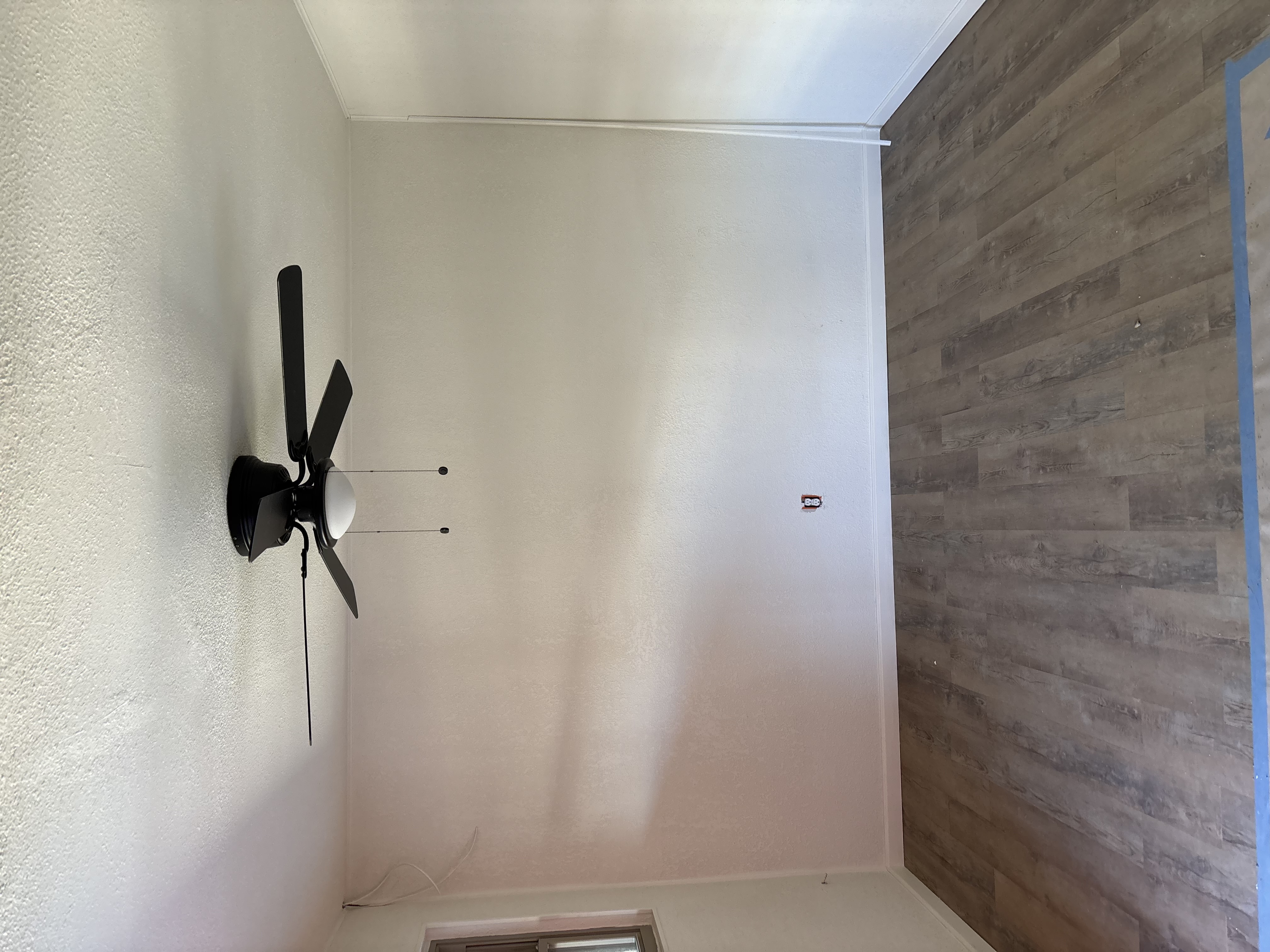 Clean bedroom with ceiling fan