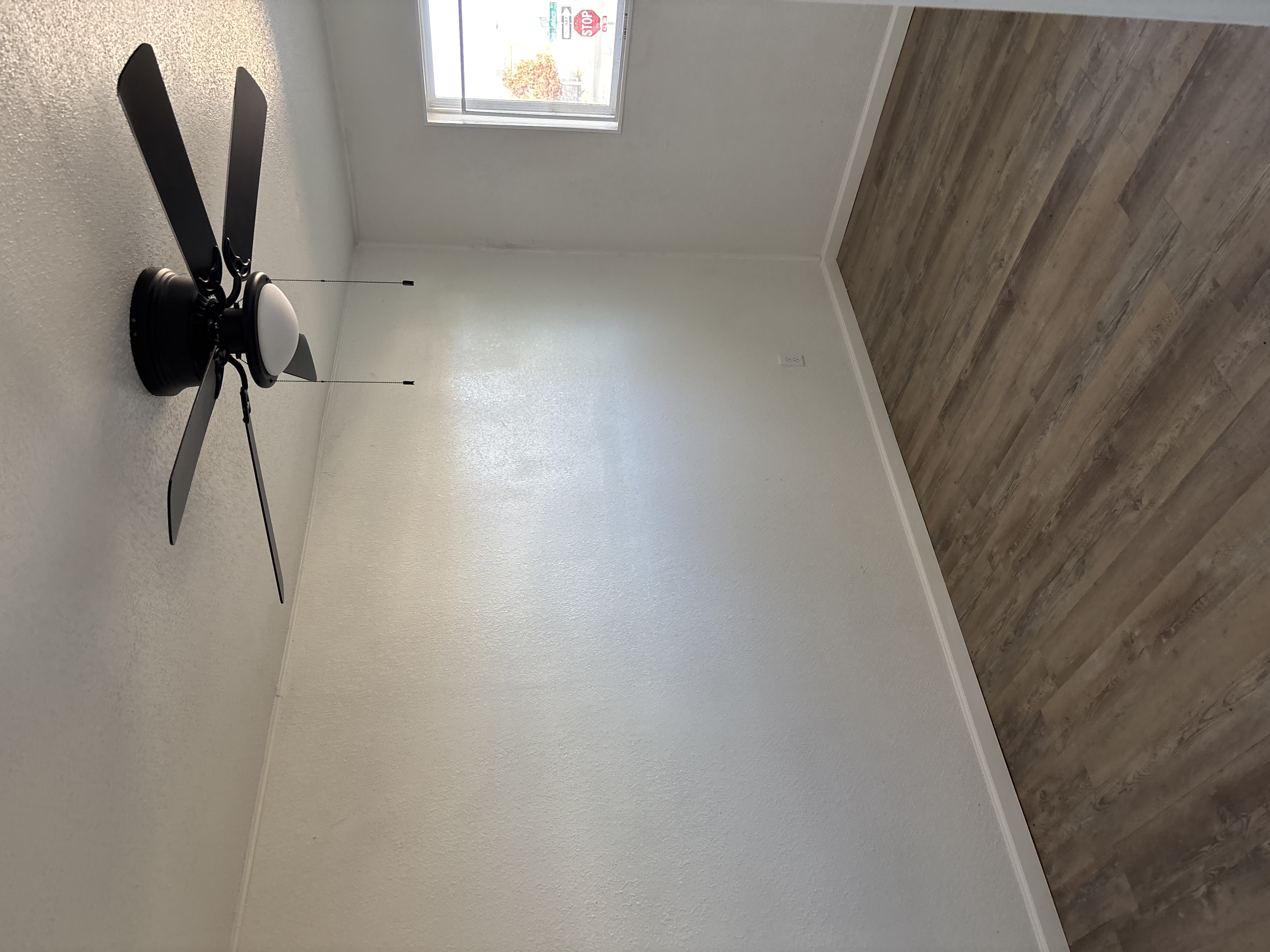 Spacious bedroom with vinyl flooring